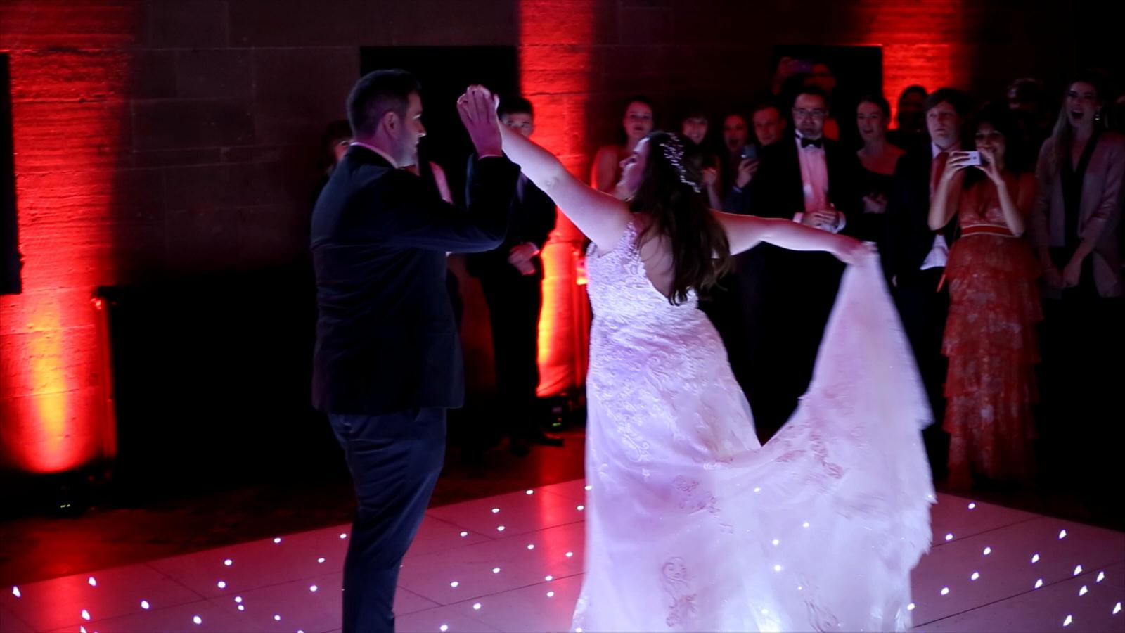 couple dance at peckforton castle