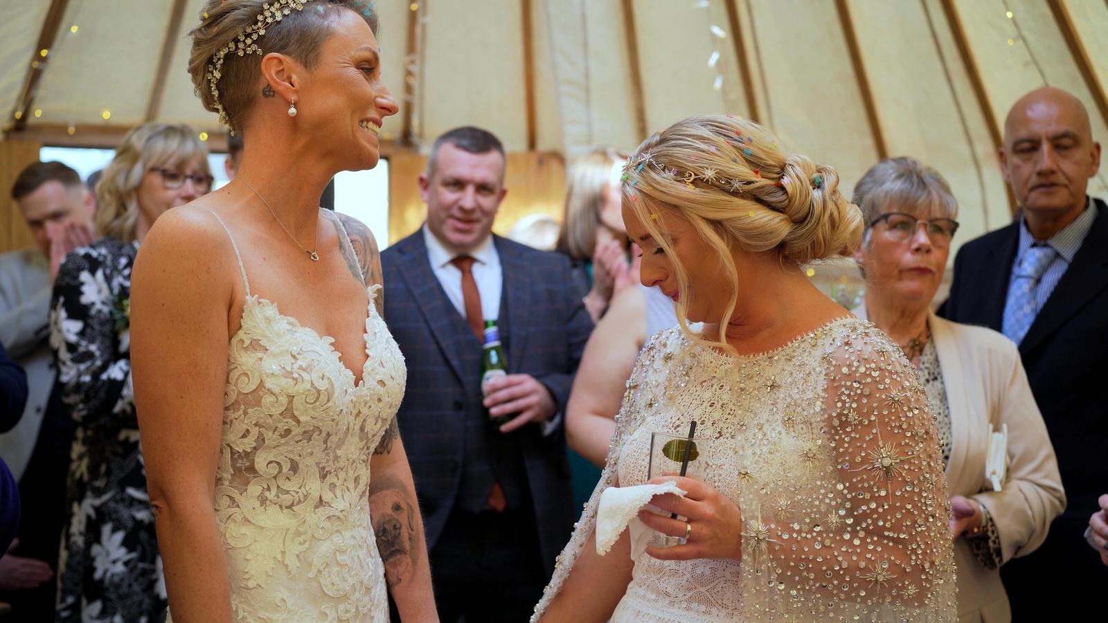 brides fight back tears during speeches inside yurt