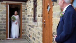 bride leaves for the ceremony with her dad