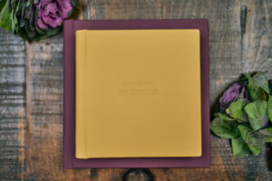 plum and honey folio albums on table