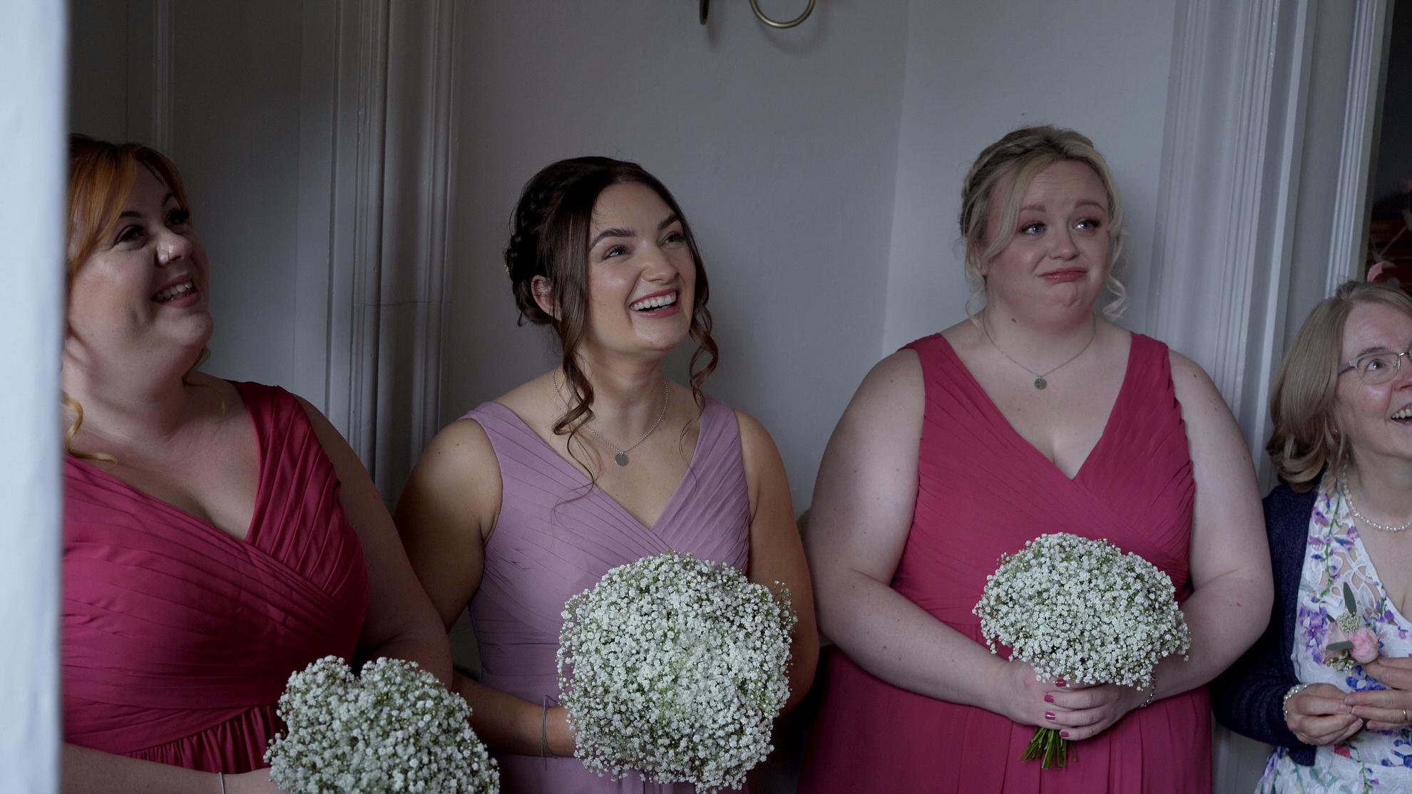 bridesmaids reaction to seeing bride walk down stairs at Wyresdale Park