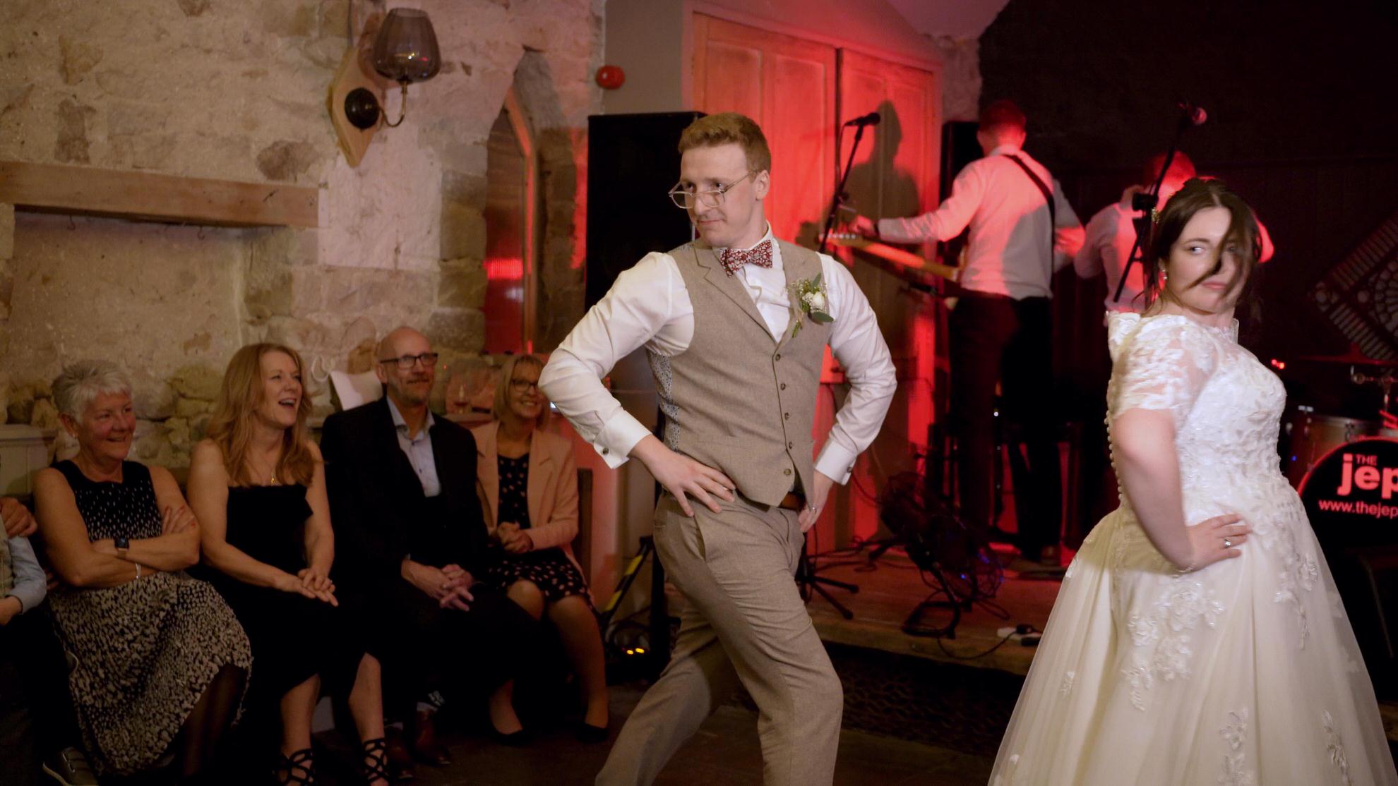 wedding video still of couple doing a surprise first dance at Wyresdale