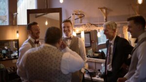 groom laughs with ushers at Wyresdale Park
