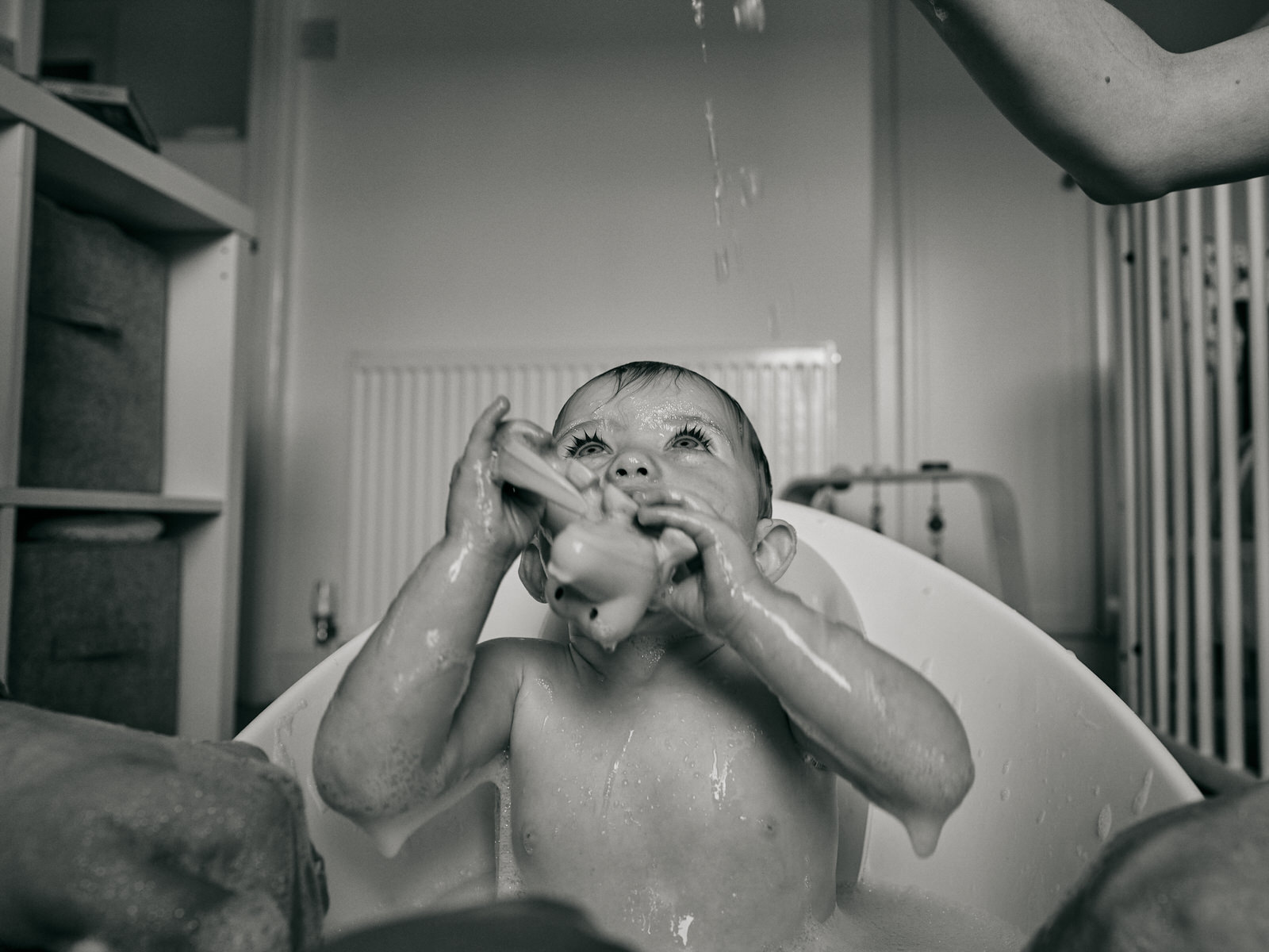 natural photo of baby in bath