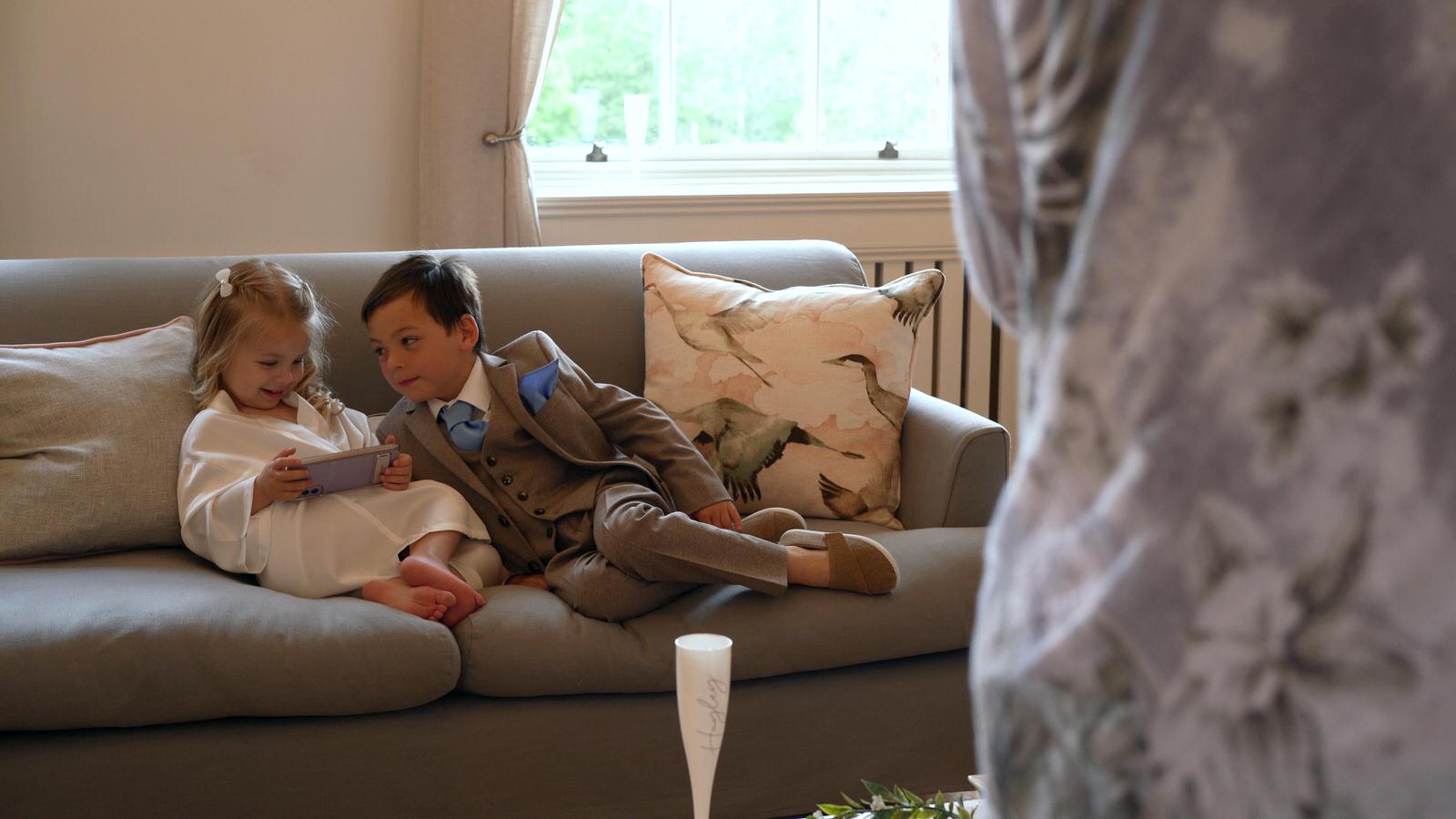 young children play on sofa at Rivington hall barn