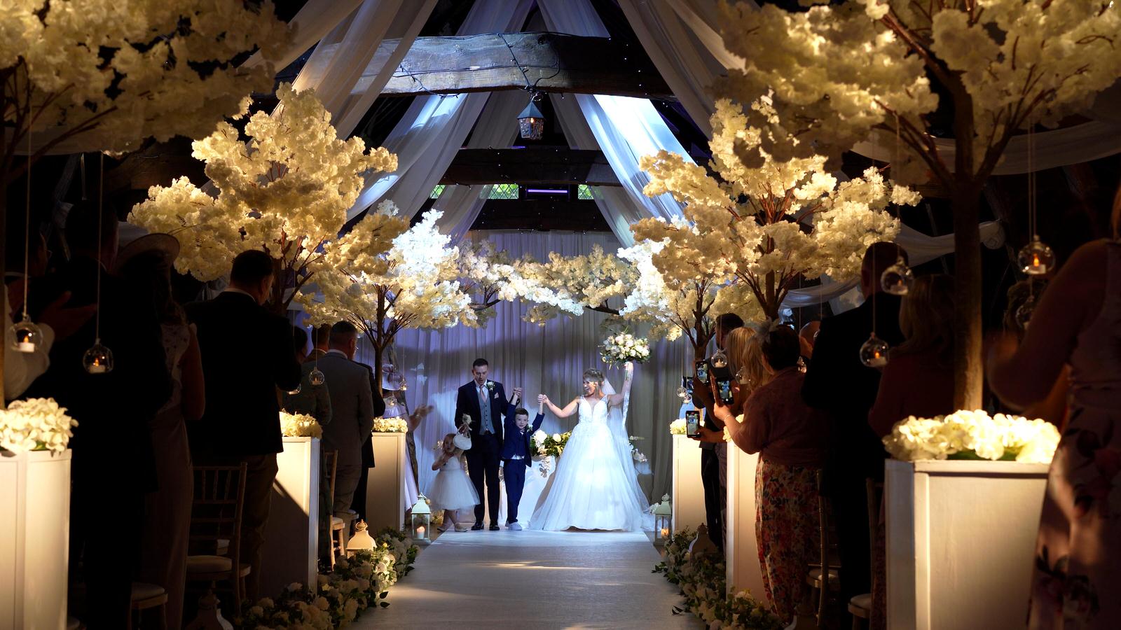 family get ready to walk down the aisle at Rivington hall barn