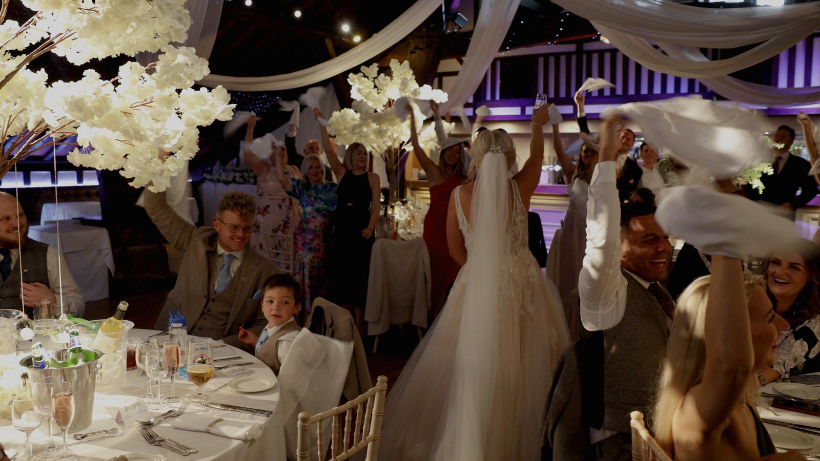 bride dances with guests during entrance