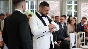 groom checks watch before wedding ceremony