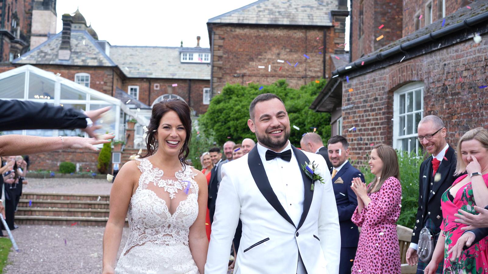 video still of couple showered in confetti