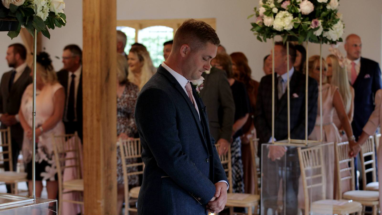 groom gets emotional waiting for bride in Ceremony room