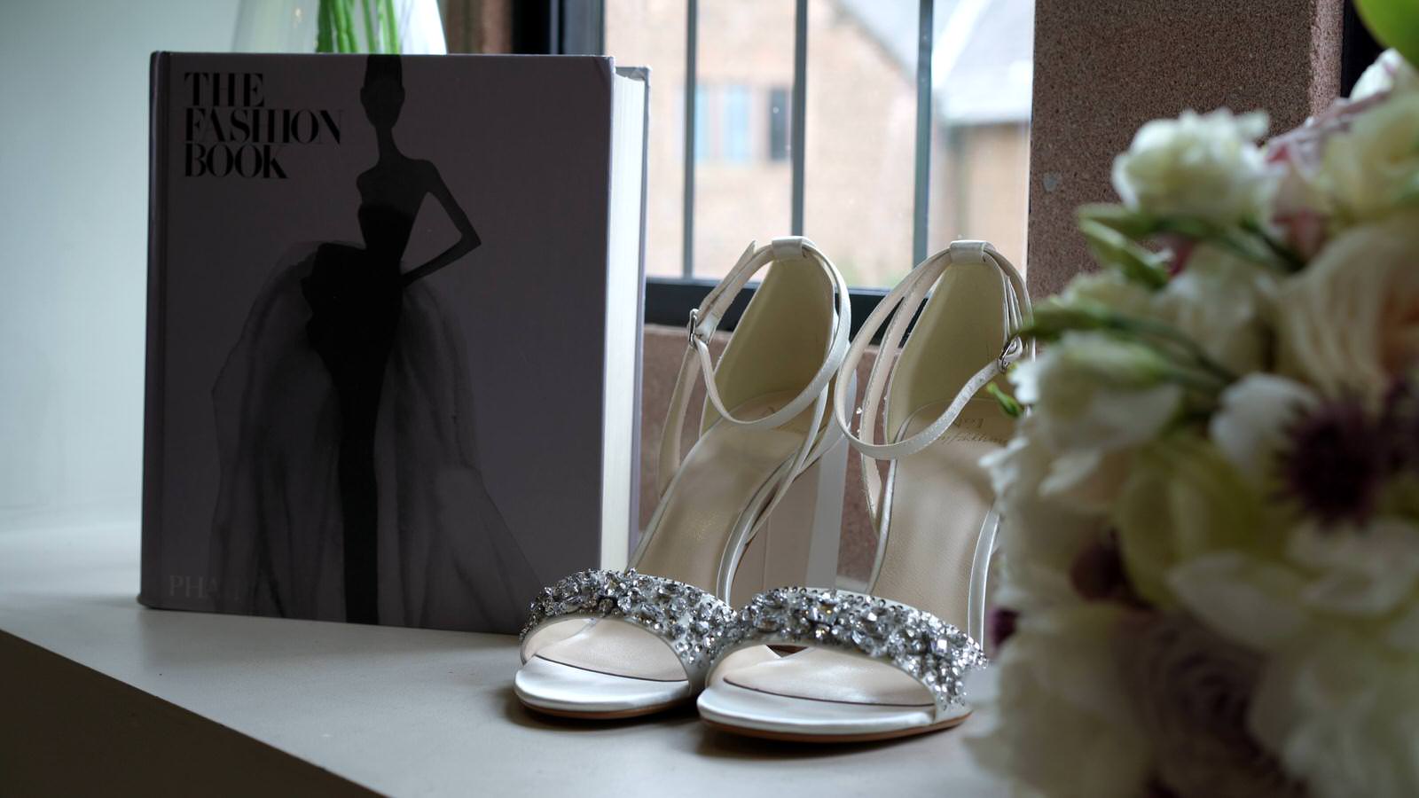 bridal shoes by window in merrydale manor suite