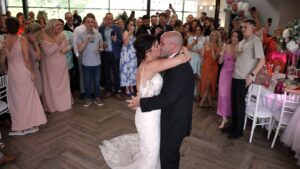 couple kiss during first dance at The Castlefield Rooms Manchester