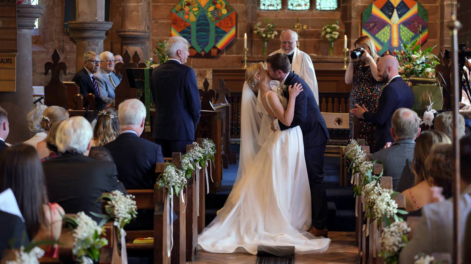 couple kiss during St Nicholas’s Church ceremony