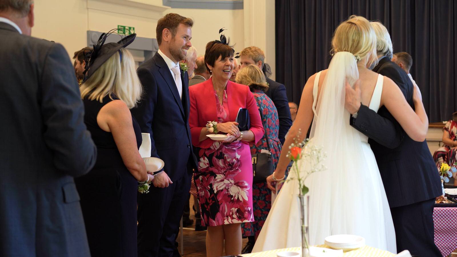 guests chat to couple during canapes at Gladstone village hall