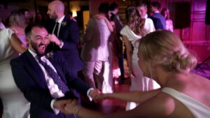 bride dances with groomsman
