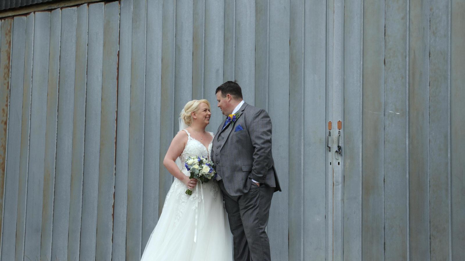 relaxed video of couple by air hangar at Beeston Manor
