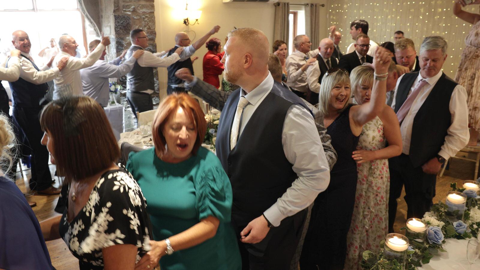 guests doing the conga at Beeston Manor