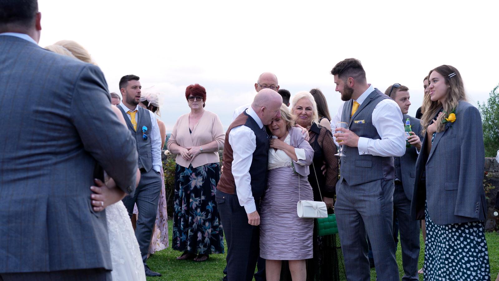 parents cry during outside first dance at Beeston Manor