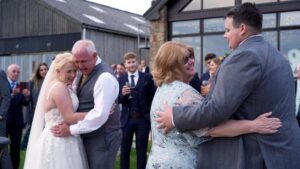 emotional father and daughter dance outside Beeston Manor