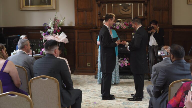 grooms exchange wedding rings at st helens town hall