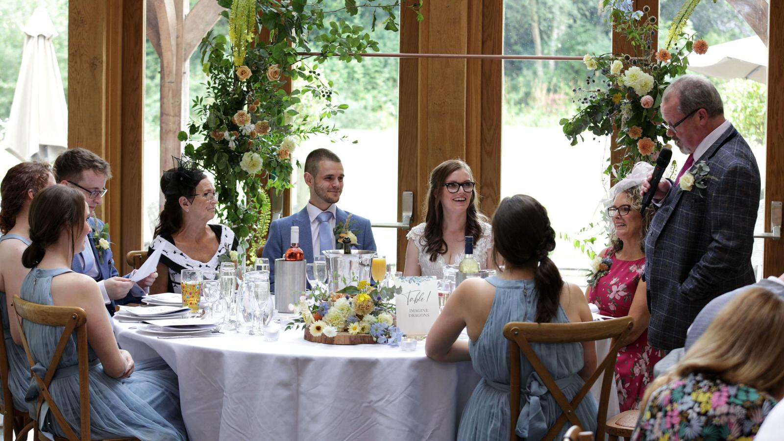 Kerry and Nicks Oaktree Peover wedding 22 top table reacting to father of the bride speech