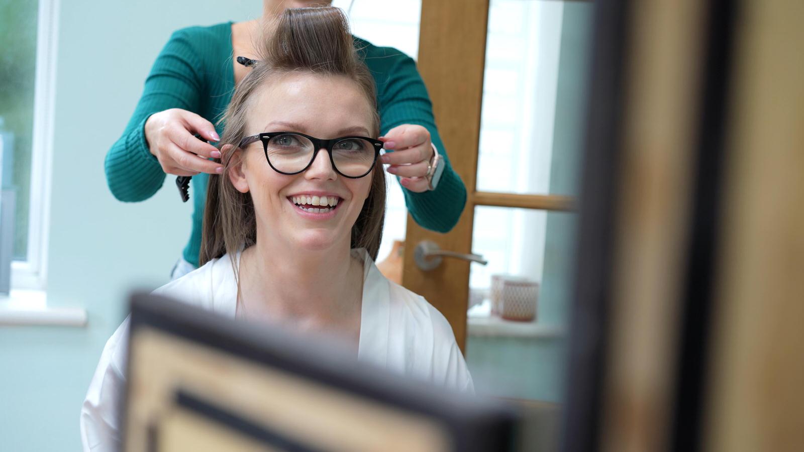 Kerry and Nicks Oaktree Peover wedding 4 bride wearing glasses having her hair done