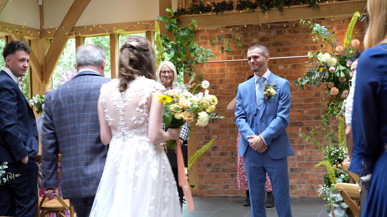 emotional reaction of grooms first look at oaktree of peover ceremony