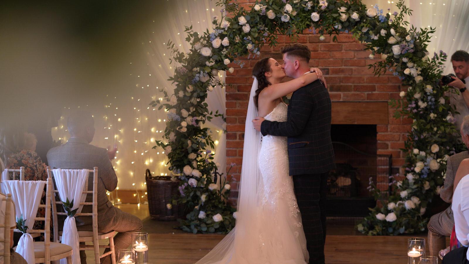 couple kiss as husband and wife during Charnock Farm ceremony