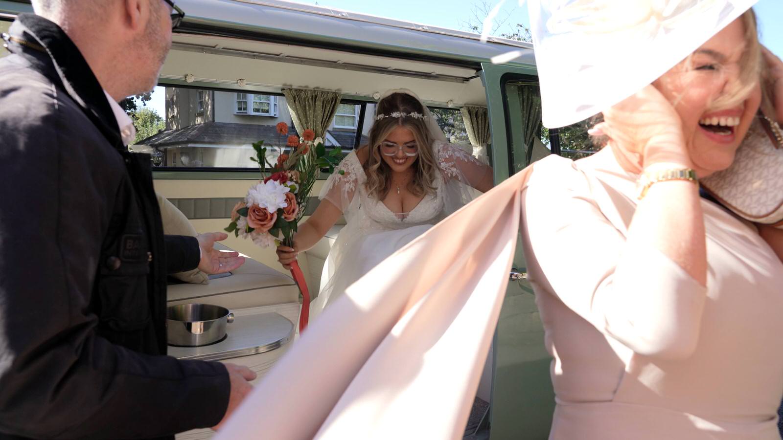bride gets out of her I Do Campers van