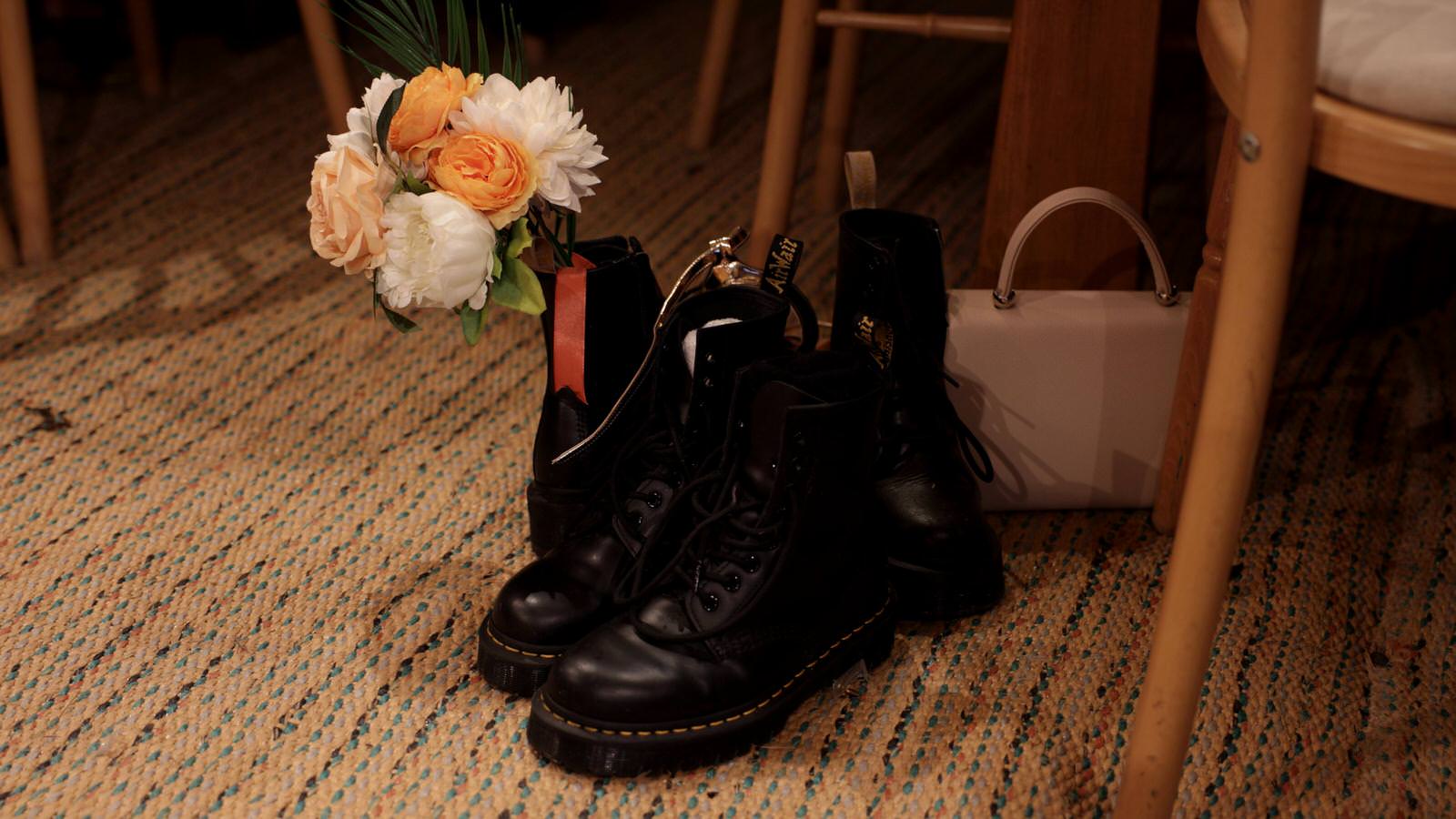doc martins and a bouquet left in a teepee