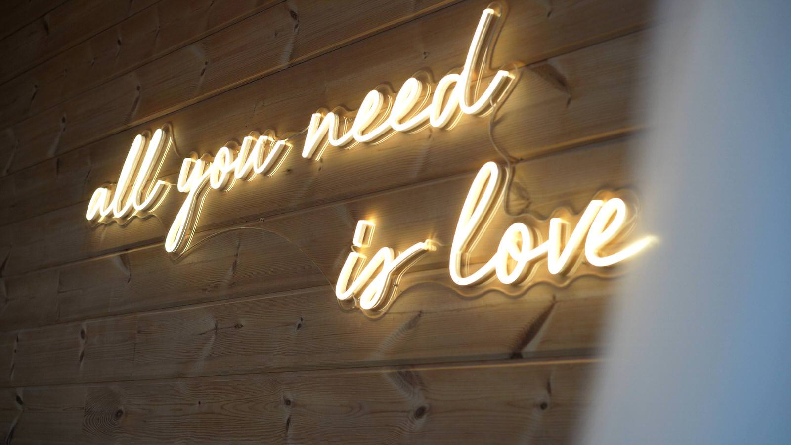 neon all you need is love sign in bridal room at Styal lodge