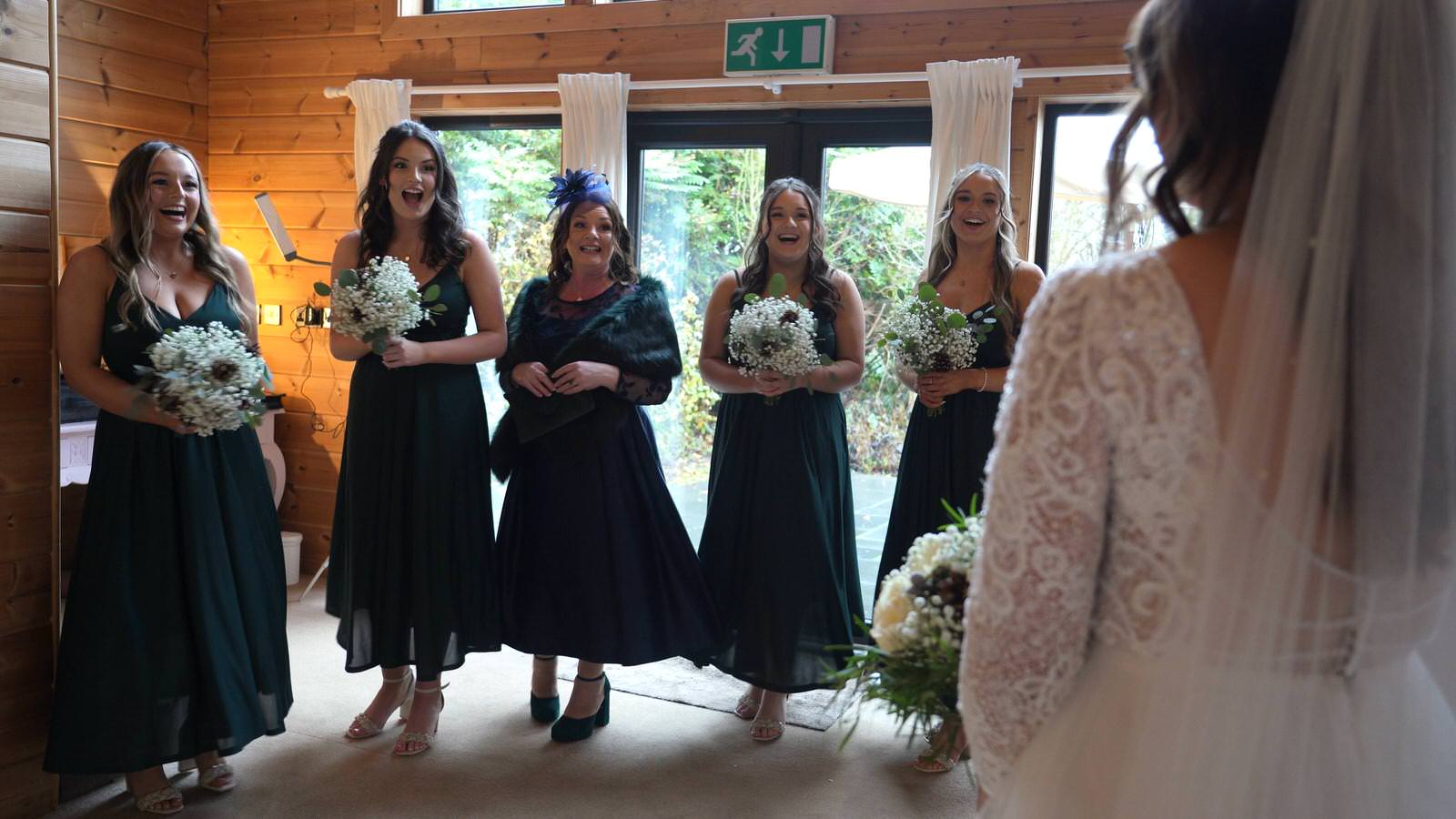 video still of bridesmaids first look reaction to bride at Styal Lodge