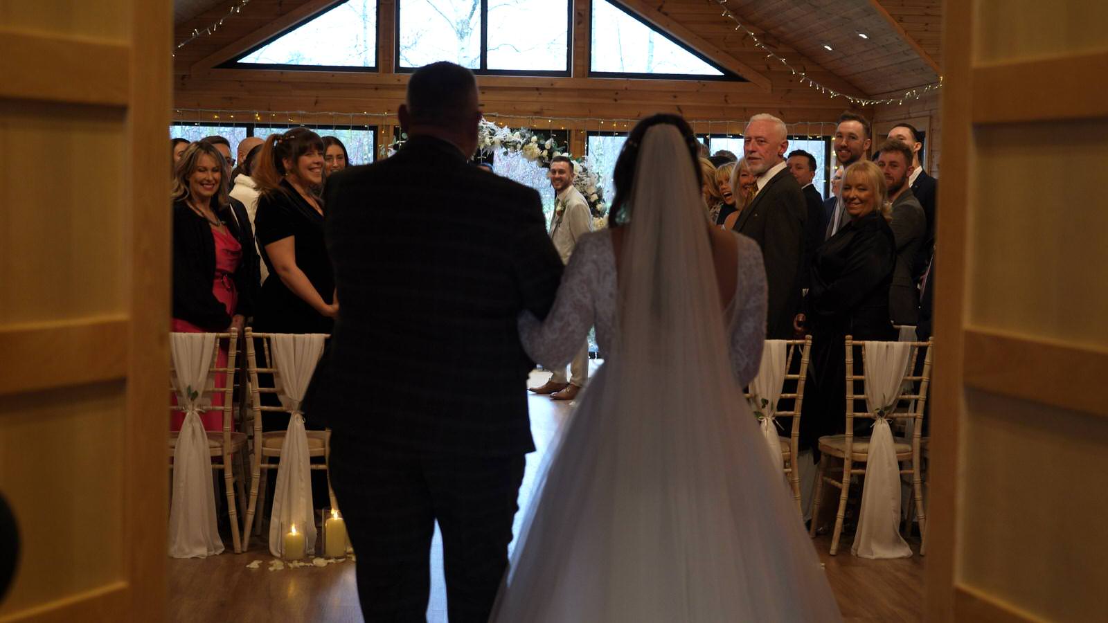 video of bride walking in to the ceremony room at Styal Lodge Cheshire