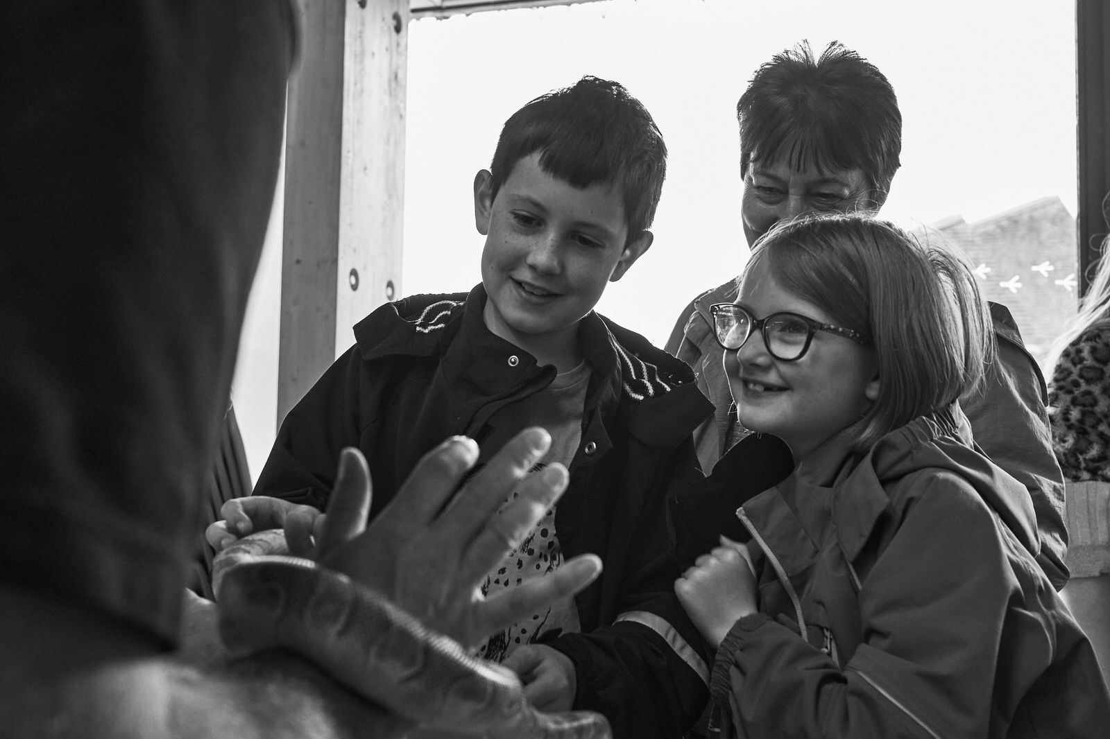 two excited kids learning about snakes at a North West Reptile club public meet