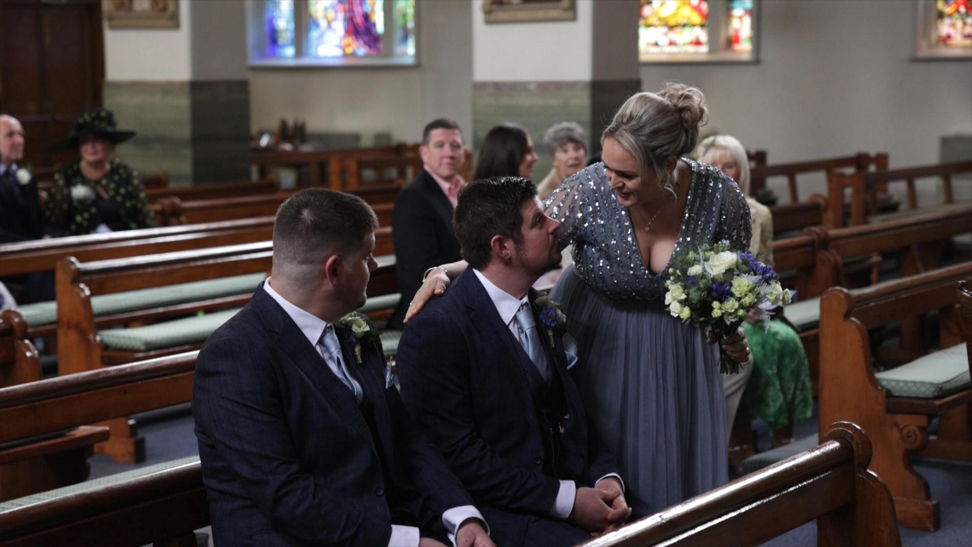 a bridesmaid smiles at the Groom in church