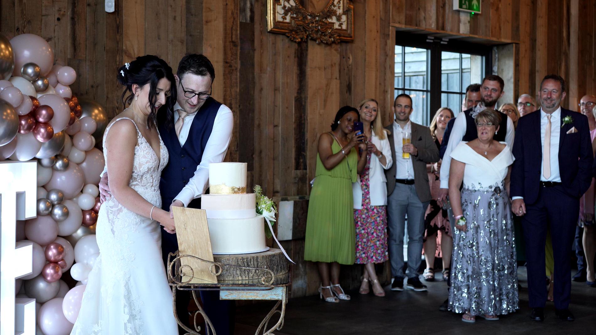 couple cut the cake at Wharfdale Grange in Yorkshire