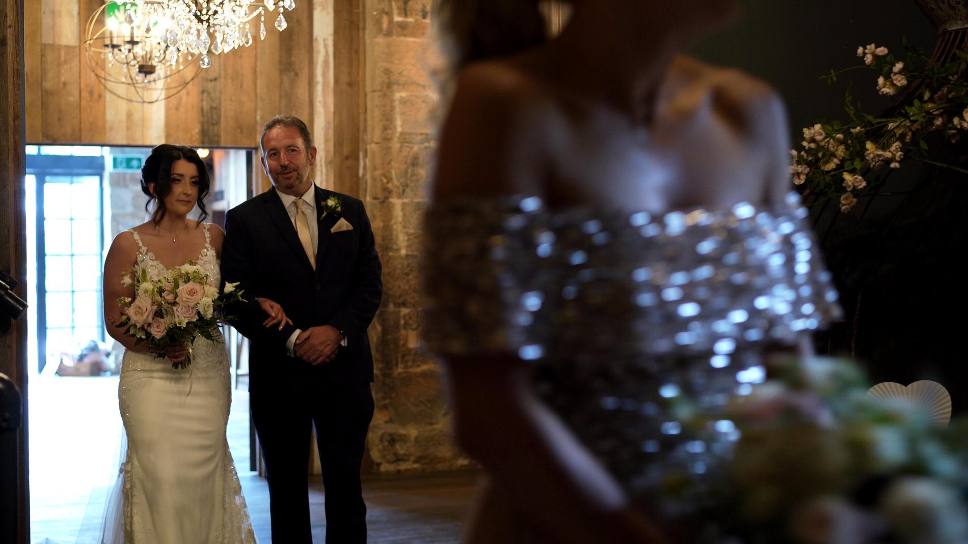 bride gets ready to walk down the aisle with her dad