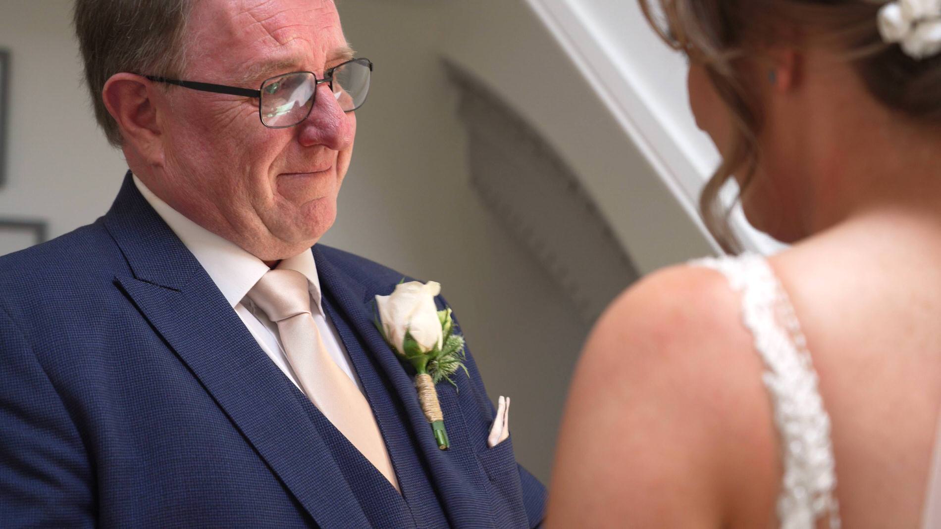 father of the bride gets emotional seeing his daughter in her dress