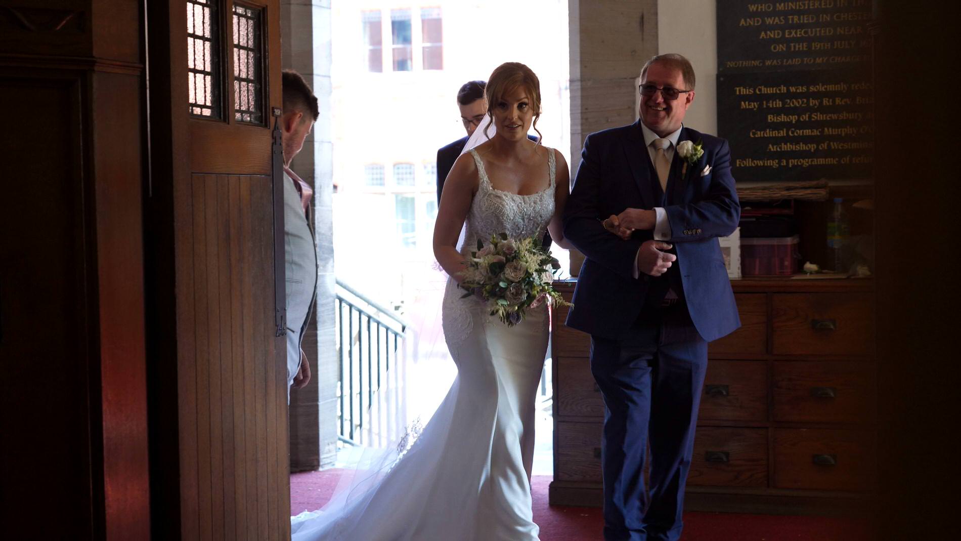 bride gets ready to walk down the aisle with her Dad at St Werburgh's Church