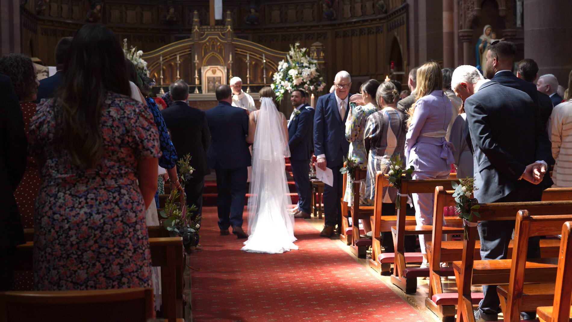 bride and dad walk down the aisle at St Werburgh's Church chester