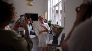 bride gets emotional and laughs opening gifts