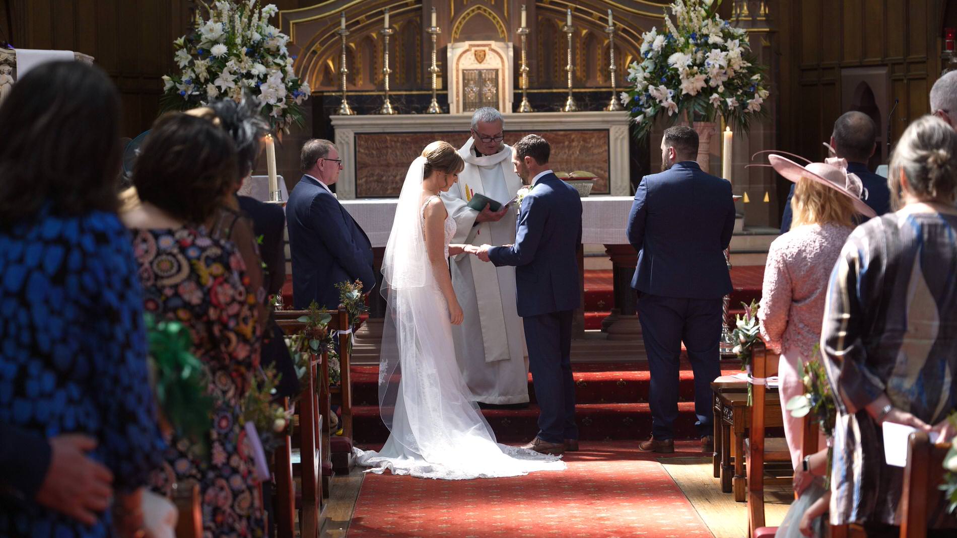 rings exchanged during ceremony at St Werburgh's Church chester