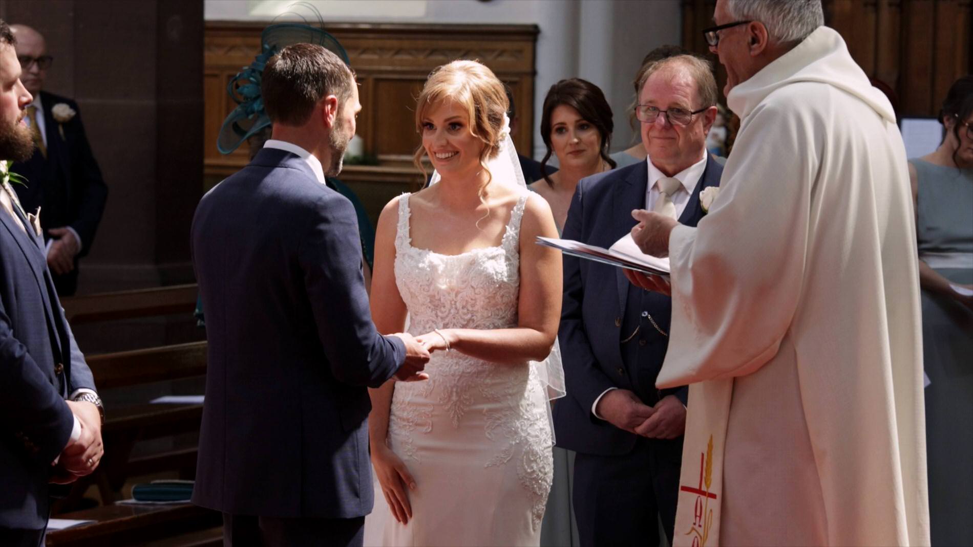 rings exchanged during vows at Chester church wedding