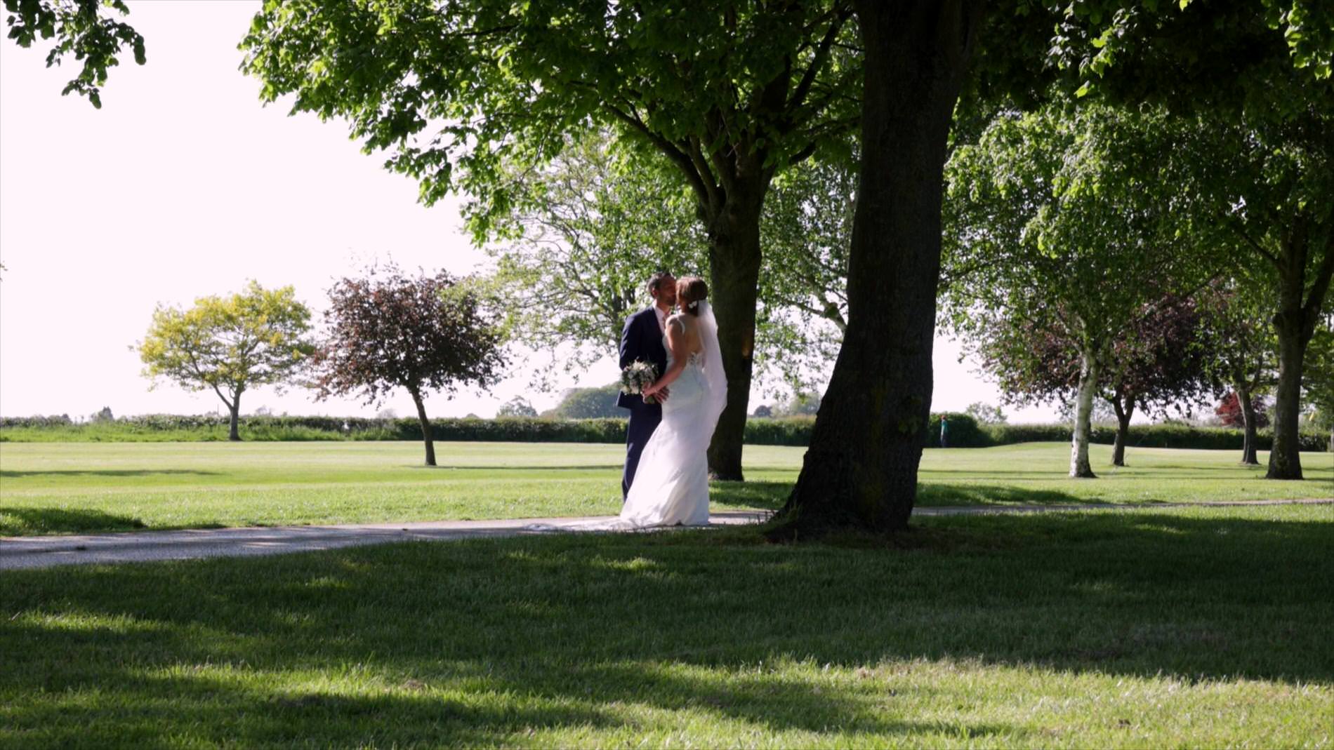 couple stand under trees at Pryors Hayes Golf Club