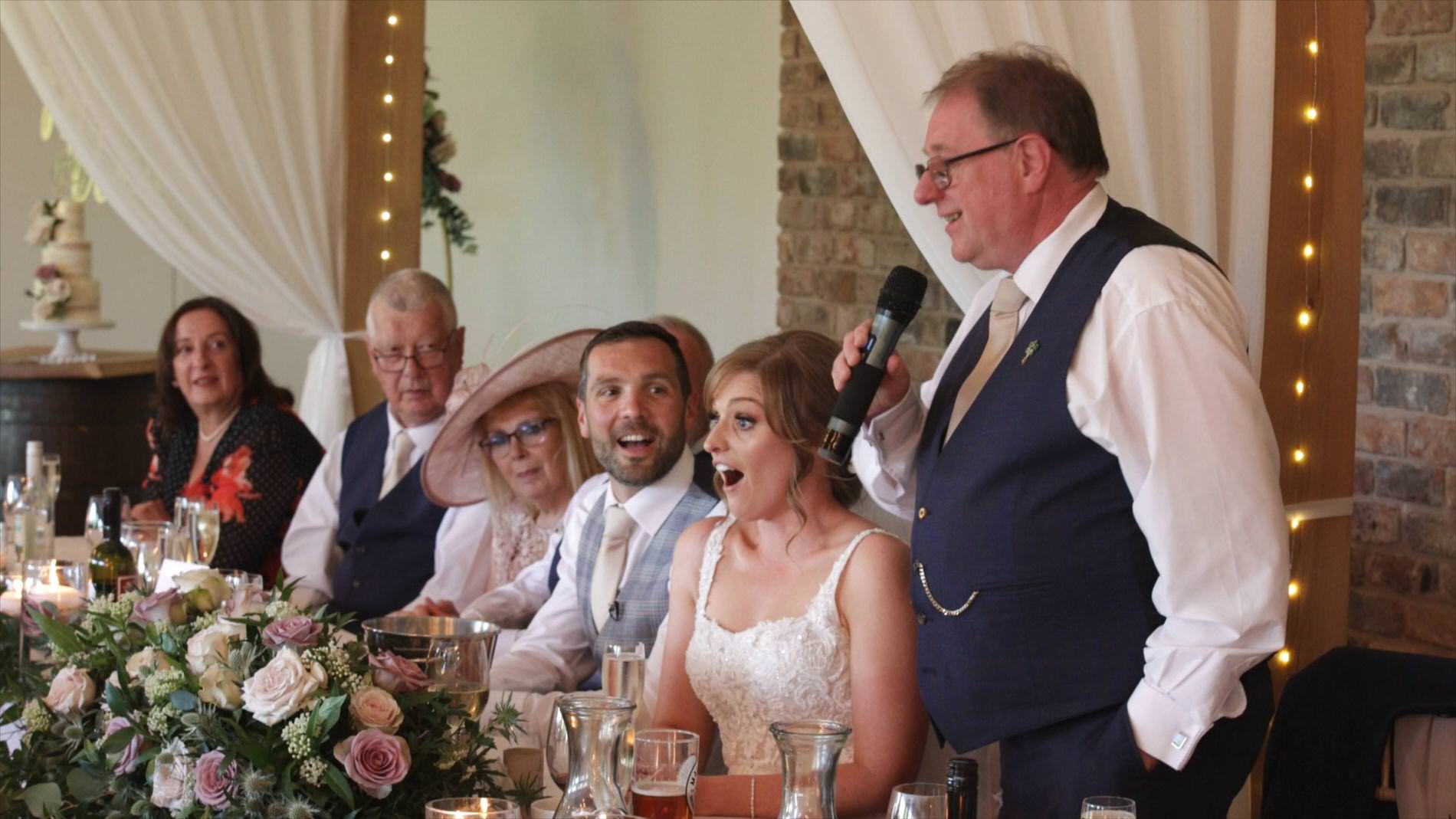 the bride looks offended by her Dads speech at Pryors Hayes Golf Club