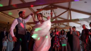 a fun video still of a lively first dance at Pryors Hayes Golf Club