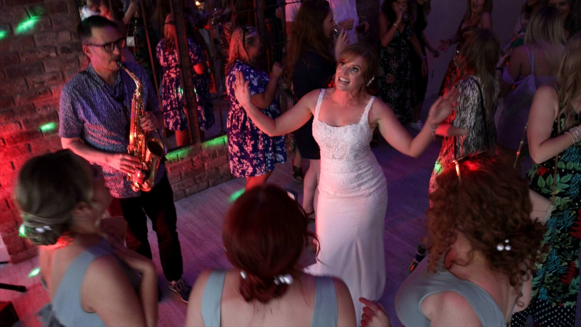 the bride dances with guests at her wedding at Pryors Hayes Golf Club