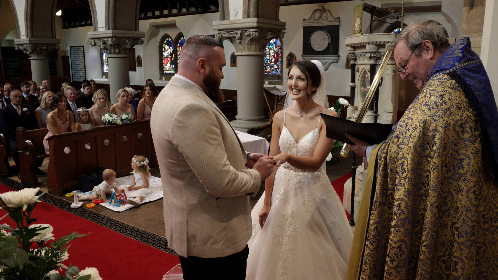 exchanging wedding rings at st mary the virgin church in rufford