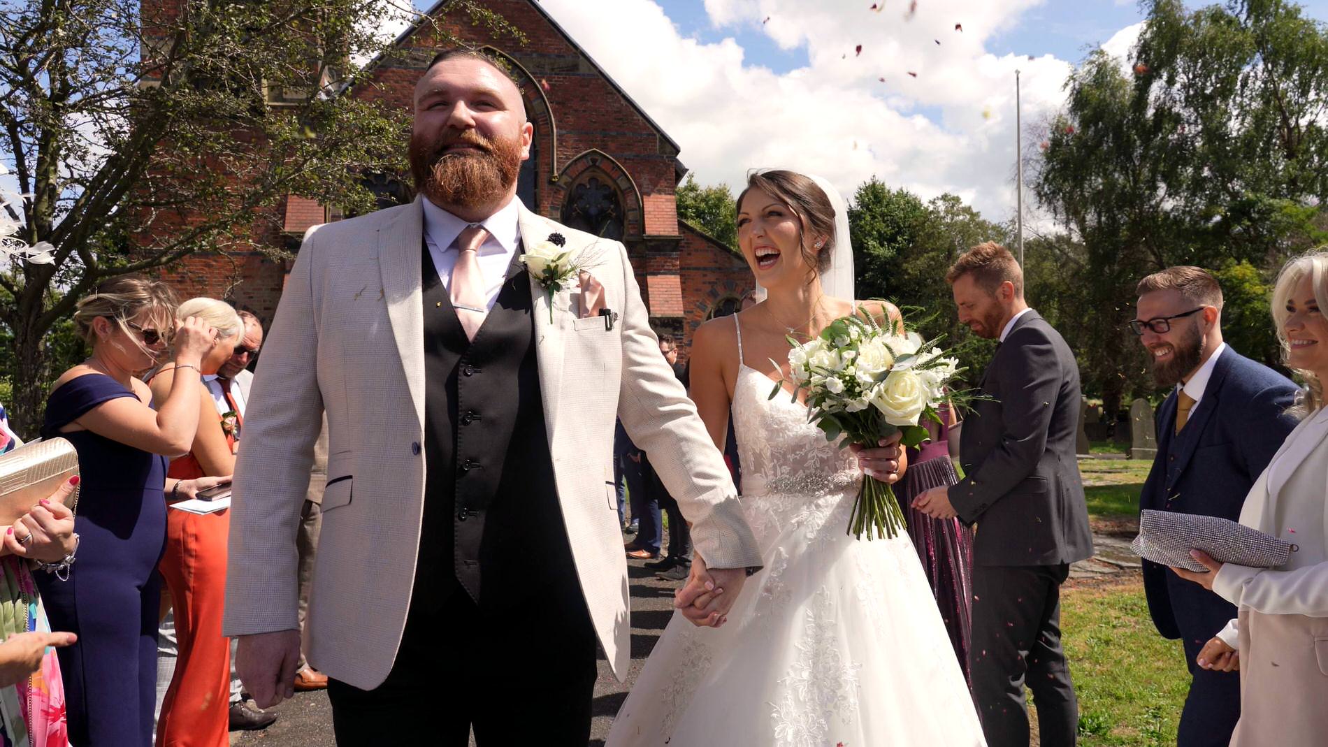 a videographer captures the confetti shot at st mary the virgin church in rufford