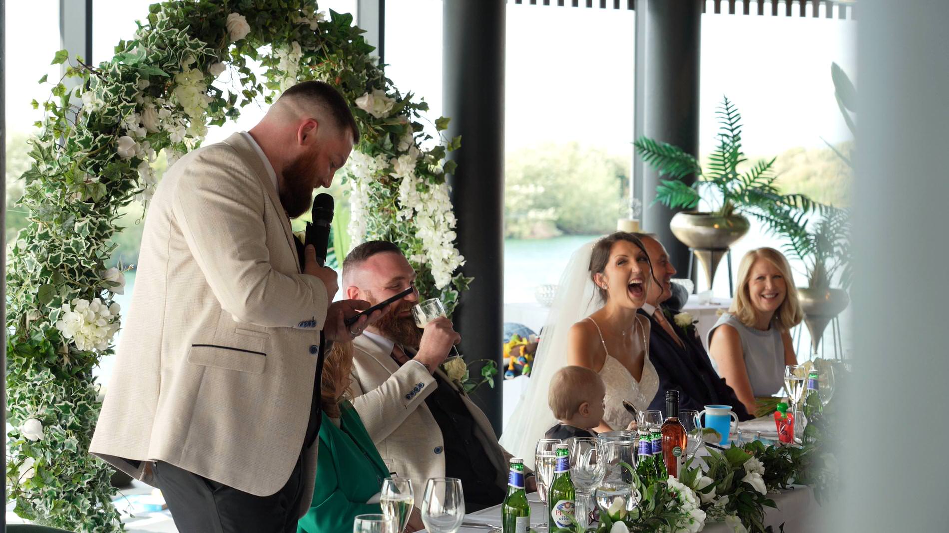 the top table laughs during speeches at The Waterfront Southport